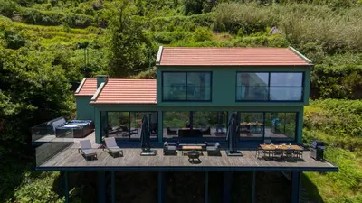 an aerial view of a house with a deck at Panorama House by LovelyStay in São Vicente