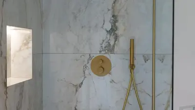 a bathroom with a shower with a wall at Panorama House by LovelyStay in São Vicente