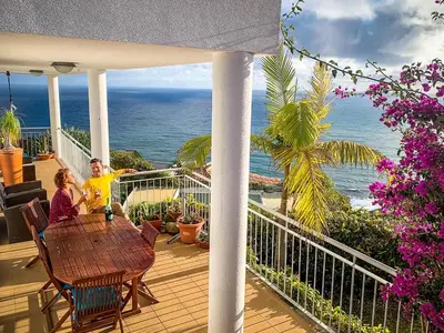 a balcony with a view of the ocean at Indigo Star House in Ribeira Brava