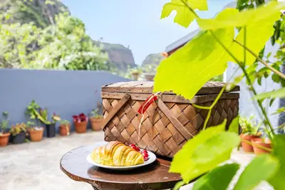 a plate of croissants on a table with a basket at Sounds of Nature in Santana