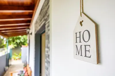 a no me sign hanging on the side of a building at Sounds of Nature in Santana