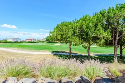 a view of a golf course with trees at Casa Maria at Boavista Resort Lagos in Atalaia
