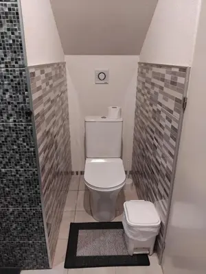 a bathroom with a toilet and a shower at MM House in Bicas