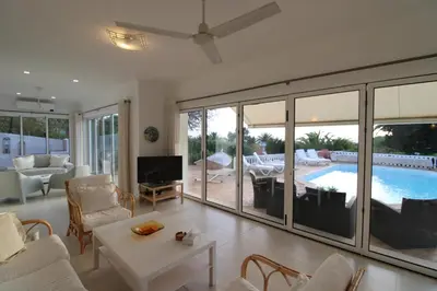 a living room with a view of a pool at Casa Tenente Camilo in Lagos
