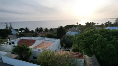 a view of a city with the ocean in the background at Casa Tenente Camilo in Lagos