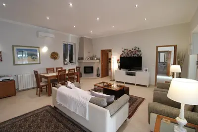 a living room with a couch and a table at Casa Tenente Camilo in Lagos