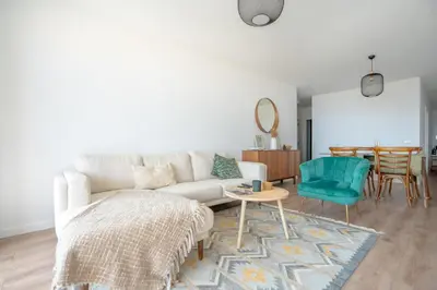 a living room with a couch and a table at Hygge Madeira by LovelyStay in Caniço