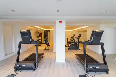 a gym with treadmills and elliptical machines at GuestReady - Soothing escape in Funchal in Funchal