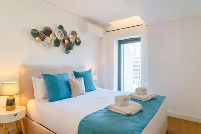 a bedroom with a bed with towels on it at GuestReady - Soothing escape in Funchal in Funchal