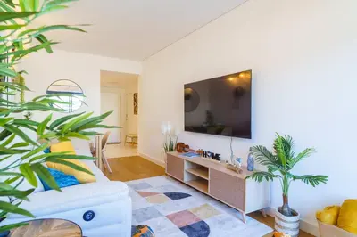 a living room with a tv and a couch at GuestReady - Soothing escape in Funchal in Funchal