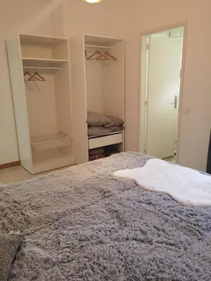 a bedroom with a bed and a closet at Honey Factory House in Santa Cruz