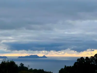a view of the ocean under a cloudy sky at Honey Factory House in Santa Cruz