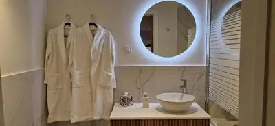 a bathroom with a sink and a mirror at Shell Living - KOS in Funchal