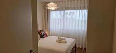 a bedroom with a bed and a window with a pillow at Shell Living - KOS in Funchal