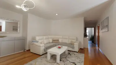 a living room with a couch and a table at Apartamento Luar in Ribeira Brava