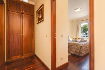 a room with a door leading to a bedroom at Strelitzia Apartment by AH in Caniço