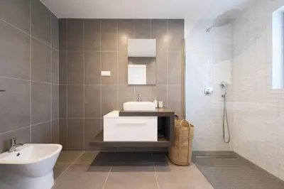 a bathroom with a sink and a bath tub at Beach Condominium 27 by Destination Algarve in Santo Amaro