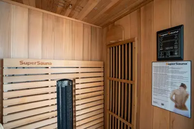 a sauna with a shower in a wooden wall at BravaSol by LovelyStay in Tábua
