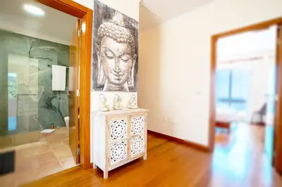 a living room with a large painting on the wall at BravaSol by LovelyStay in Tábua