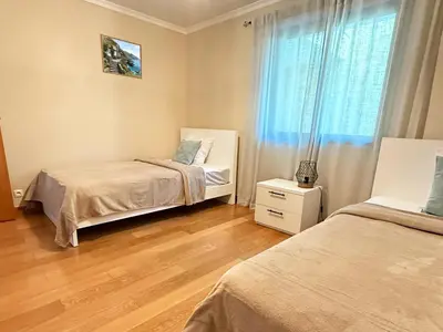 a bedroom with two beds and a window at 10 min to Calheta Beach - Apartamento Da Natureza - KING Size Bed - LARGE Terrace in Arco da Calheta