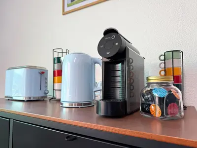 a counter with a coffee maker on top of it at 10 min to Calheta Beach - Apartamento Da Natureza - KING Size Bed - LARGE Terrace in Arco da Calheta