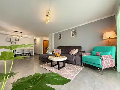 a living room with a couch and a table at 10 min to Calheta Beach - Apartamento Da Natureza - KING Size Bed - LARGE Terrace in Arco da Calheta