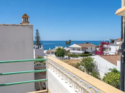 a view of the ocean from a balcony at Traditional house by the beach #1979 in Luz