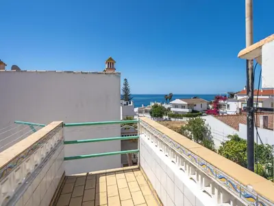 a balcony with a view of the ocean at Traditional house by the beach #1979 in Luz