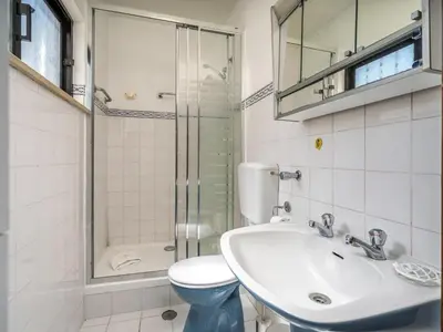 a bathroom with a toilet and a sink and a shower at Traditional house by the beach #1979 in Luz