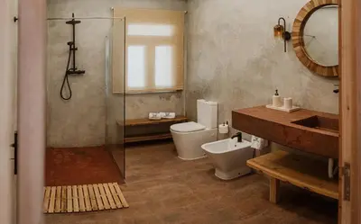 a bathroom with a toilet and a sink and a shower at AZORINSITU - Casas da Ribeira in Vila do Porto