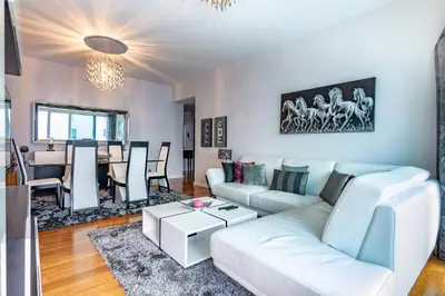 a living room with a white couch and a table at Alameda in Funchal
