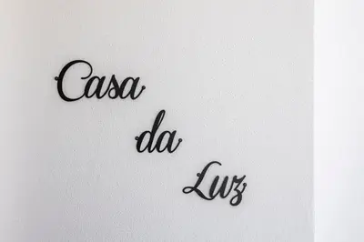 a sign with the words casa do lobos on it at Casa da Praia da Luz T2 plus 1 in Luz
