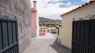 a view from the balcony of a house with a gate at Starry View in Funchal