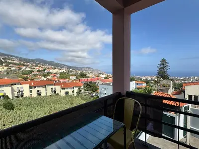 a balcony with a view of a city at Starry View in Funchal
