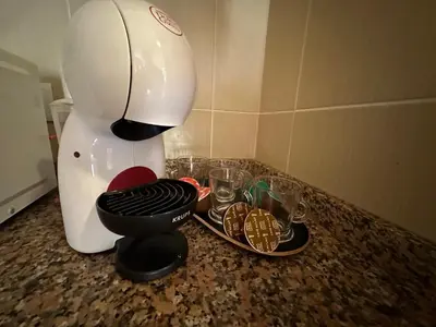 a mixer sitting on top of a counter with cookies at Apartamentos da Carreira in Funchal