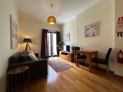 a living room with a couch and a table at Apartamentos da Carreira in Funchal