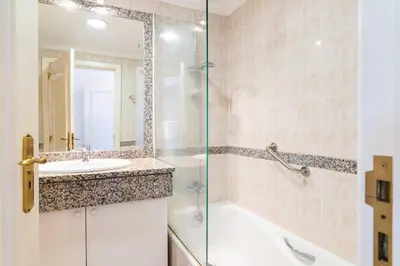 a bathroom with a sink and a shower at GuestReady - Caniço city view in Caniço