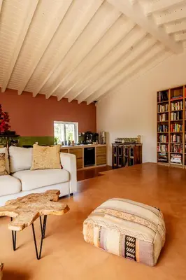 a living room with a white couch and a table at Casa Pinho Vista in Aljezur