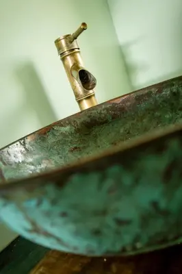 a rusty metal sink with a faucet at Casa Pinho Vista in Aljezur