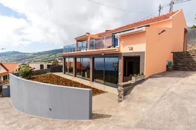a house with a view of the ocean at Casa Por Do Sol ll in Arco da Calheta