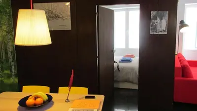 a room with a table with a bowl of fruit on it at João & Amália apartment by Rentallido in Funchal
