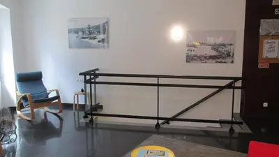 a glass table and a chair in a room at João & Amália apartment by Rentallido in Funchal