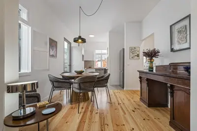 a kitchen and dining room with a table and chairs at The Graceful Manor by Homie in Funchal