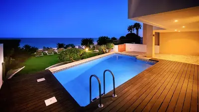 a swimming pool on the deck of a house at Luz by Check-in Portugal in Luz