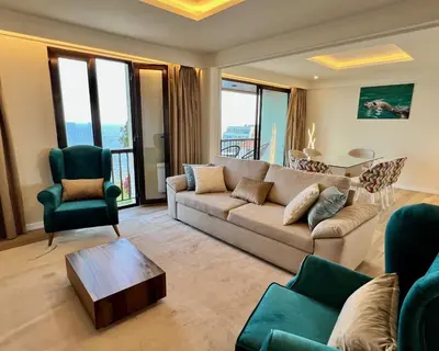 a living room with a couch and a table at Ocean Horizon in Funchal
