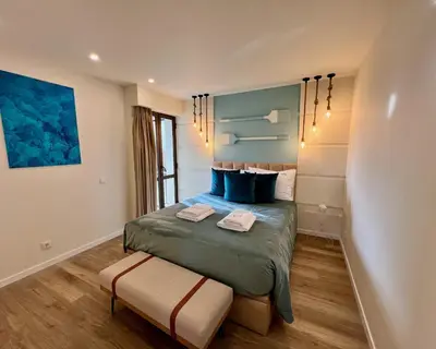 a bedroom with a bed with two towels on it at Ocean Horizon in Funchal