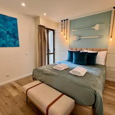 a bedroom with a bed with two towels on it at Ocean Horizon in Funchal