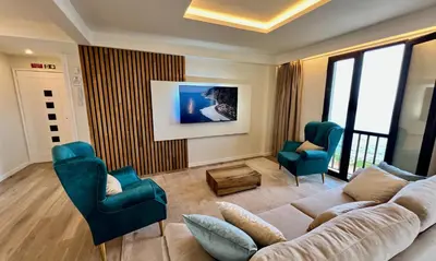 a living room with a couch and two chairs at Ocean Horizon in Funchal
