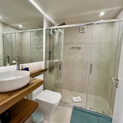 a bathroom with a shower and a toilet and a sink at Ocean Horizon in Funchal