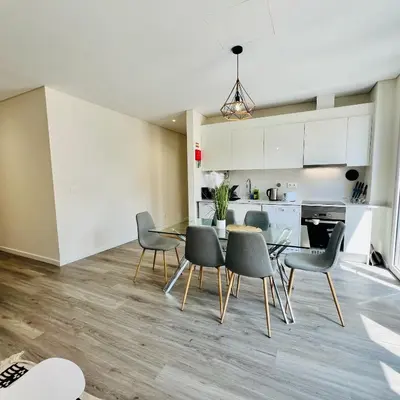 a kitchen and dining room with a table and chairs at Carmo Heritage Terrace in Funchal